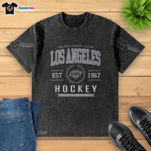 Official Los Angeles Kings Hockey Legacy Crest Washed T-Shirt featuring vintage design and team colors for fans.