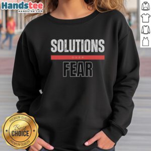 Official Solutions Over Fear Sweatshirt in black, featuring a motivational graphic design for inspiring confidence.