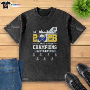 Alt Text: Buffalo Sabres 2026 Atlantic Division Champions washed t-shirt showcasing team pride and vibrant graphics.