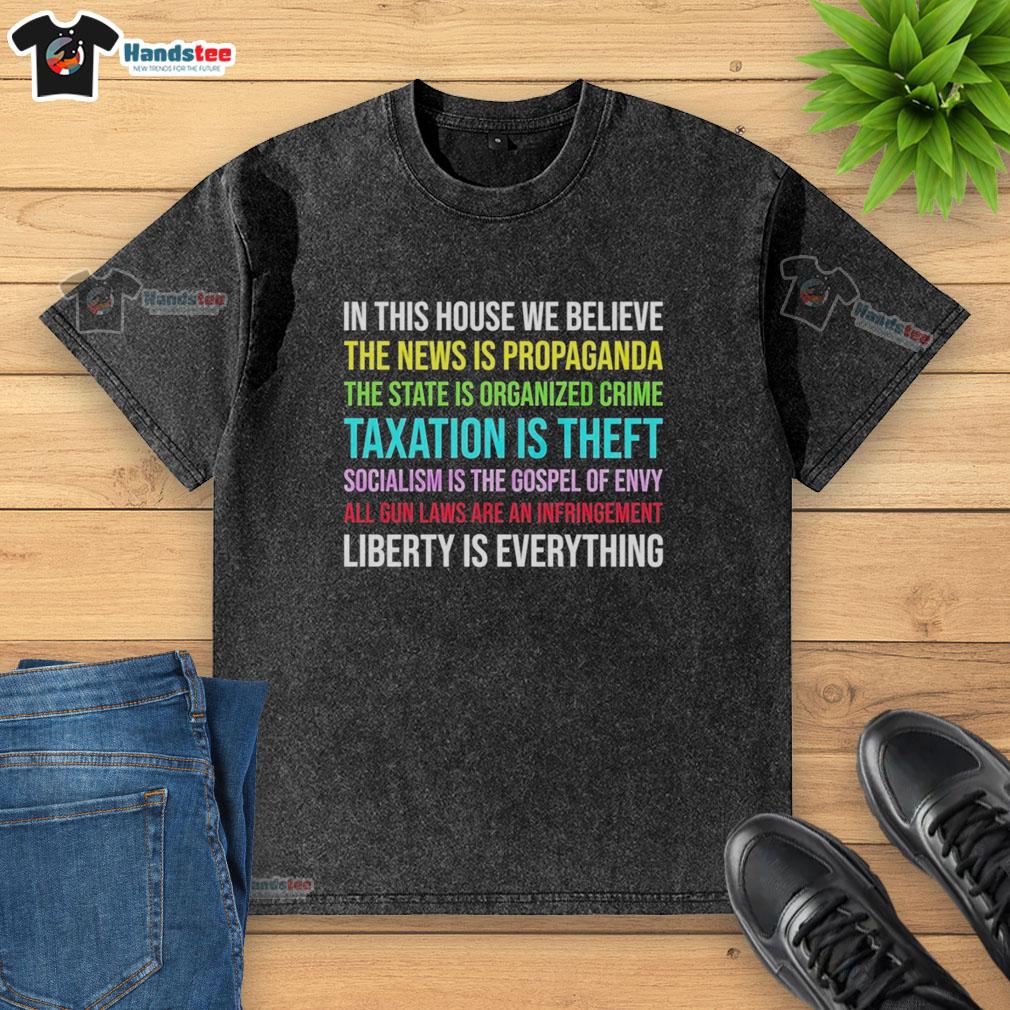 Libertarian version washed t-shirt with 'In This House We Believe' slogan, showcasing a pro-liberty message.