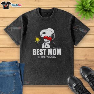 Premium Snoopy hugging a heart on a washed t-shirt, celebrating the best mom in the world with a cute design.