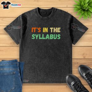 Nice It's In The Syllabus washed t-shirt displayed on a hanger, showcasing trendy casual wear for students.