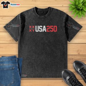 Vintage washed Official Xx Athletics Xy USA 250 T-shirt displayed on a rustic wooden background, showcasing its unique design.