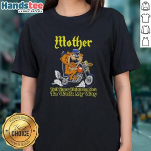 Biker ladies tee featuring a Tasmanian devil graphic with the phrase 'Tell Your Children Not to Walk My Way.'