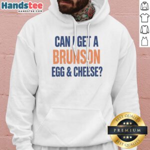 Official Can I Get A Brunson Egg Cheese Hoodie in a cozy setting, showcasing its unique design and comfortable fit.