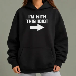 Hot Top I'M With This Idiot Hoodie in black with white text, cozy pullover with front pocket and drawstring hood