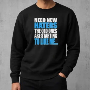 Pretty Need New Haters The Old Ones Are Starting To Like Me Quote sweater in black with white text, cozy crewneck style
